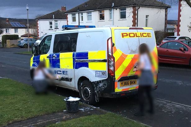 Teens forced to clean police van with toothbrushes after hurling mud at it