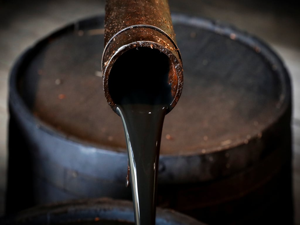 Oil prices gain as inventories fall, demand picks up