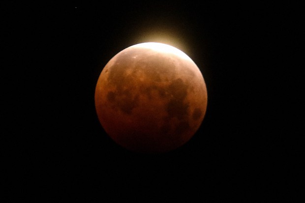 Earth’s shadow creeps across moon ahead of super blood moon