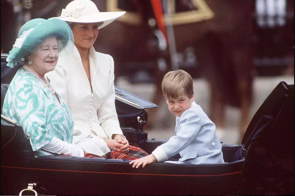 Princess Charlotte and Prince George ride in the Queen’s carriage.