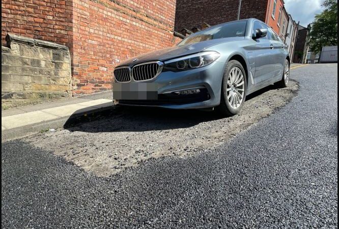 Road was resurfaced Around BMW as driver failed to move their car.
